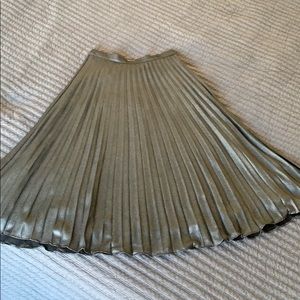 Pleated, dark silver, mid calf length skirt.